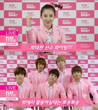 人気アイドルグループ2NE1（トゥエニィワン）のサンダラ・パク（ダラ）とSHINee（シャイニー）が、水泳の韓国代表パク・テファン選手とチョン・ダレ選手を応援する映像を送り、話題になっている。